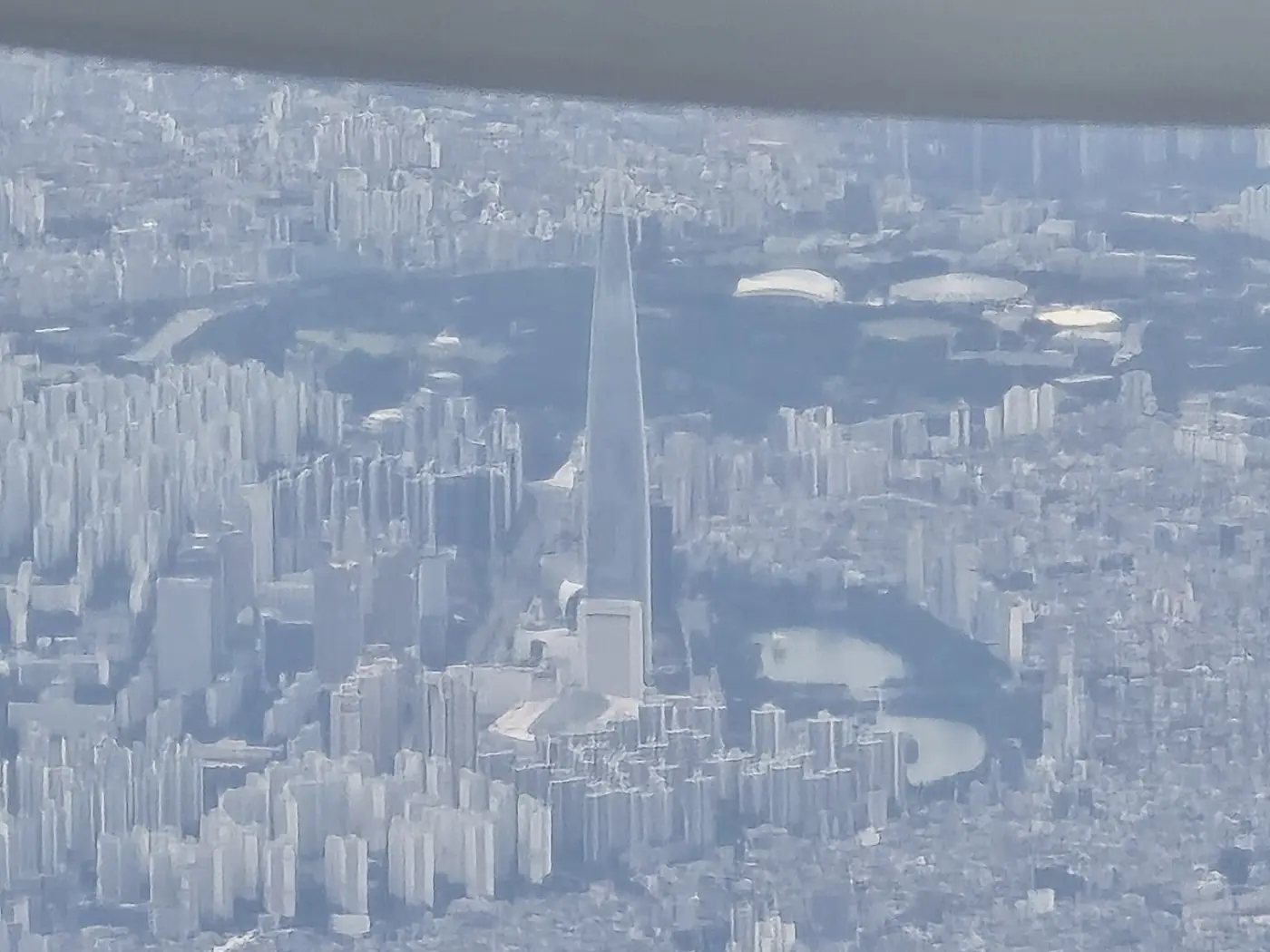 Aerial view of dense high-rises around Lotte World Tower in Seoul