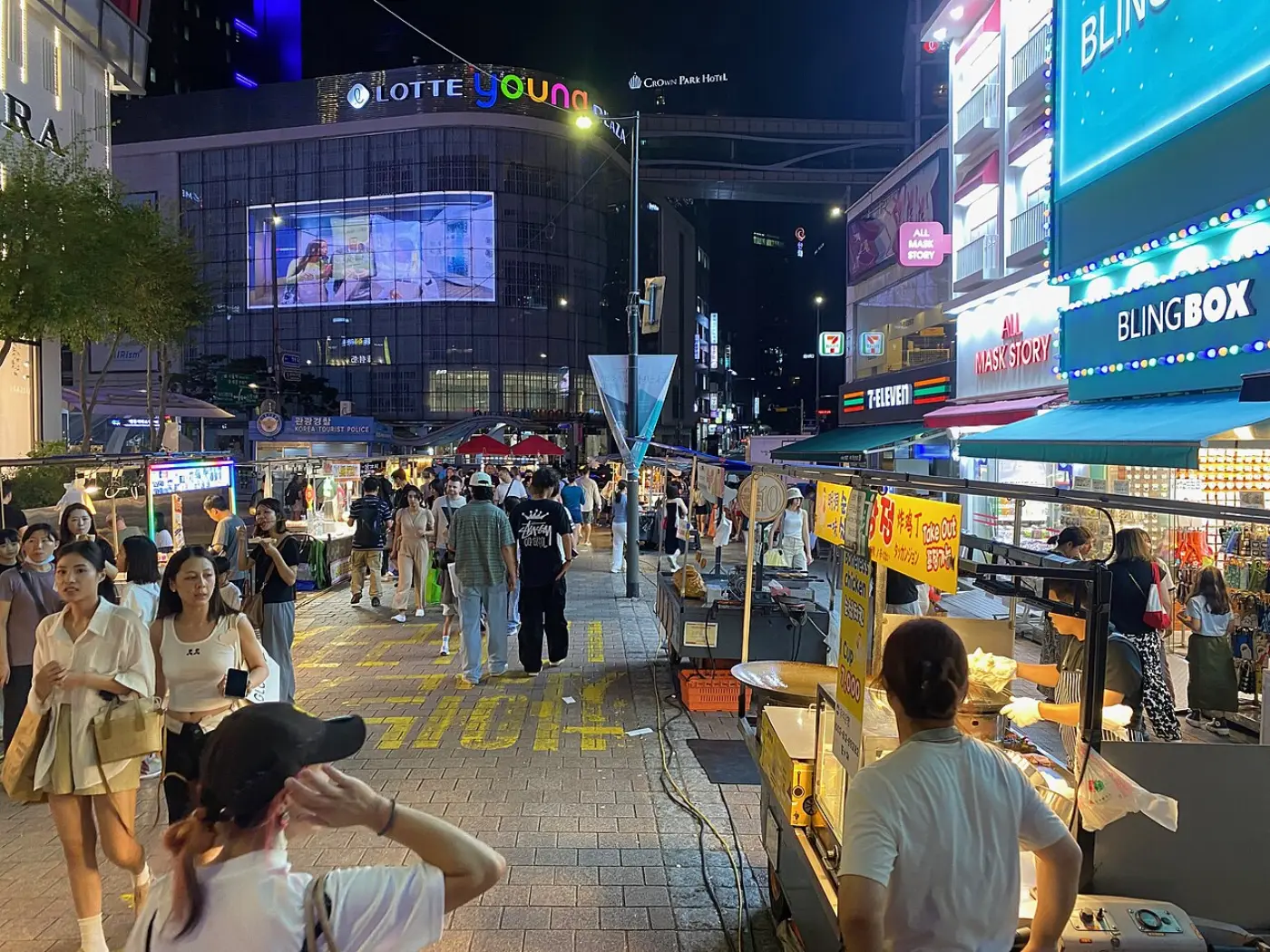 Myeongdong street in Seoul crowded with stalls and shoppers at night