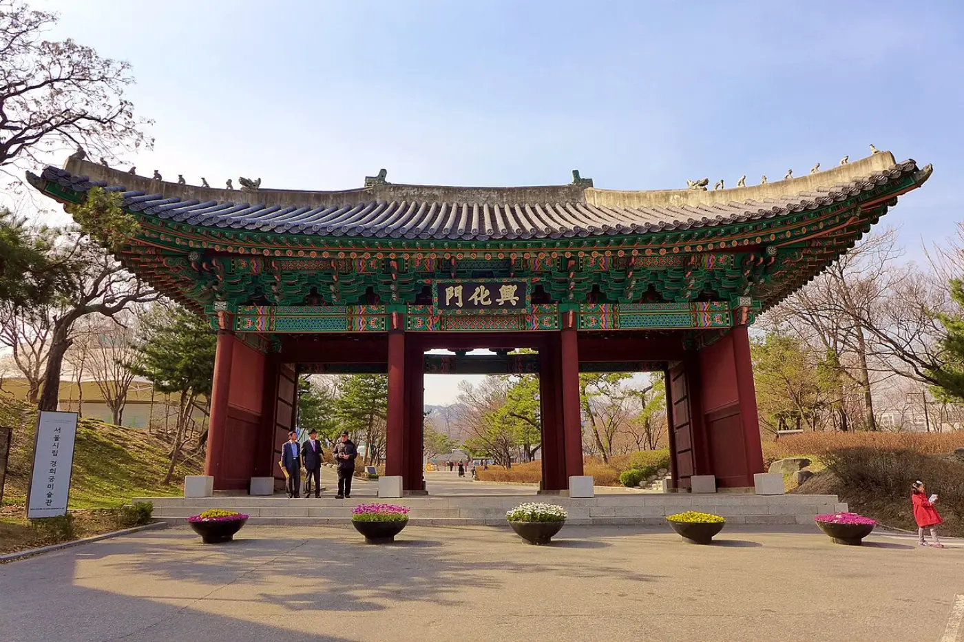 Front view of Heunghwamun, the main gate of Gyeonghuigung, with red pillars and painted eaves