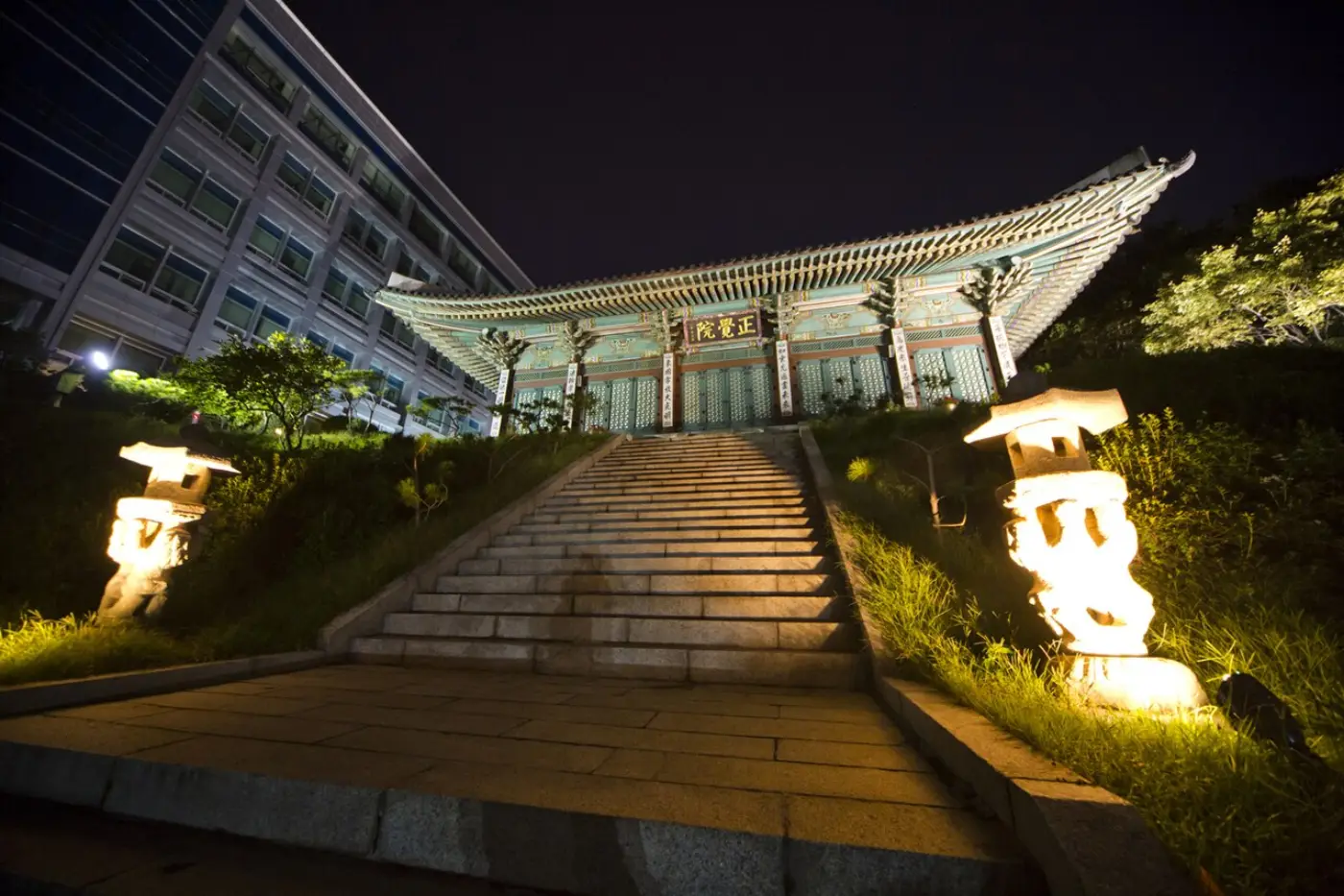 Night view of Jeonggakwon at Dongguk University, set above a flight of stone stairs